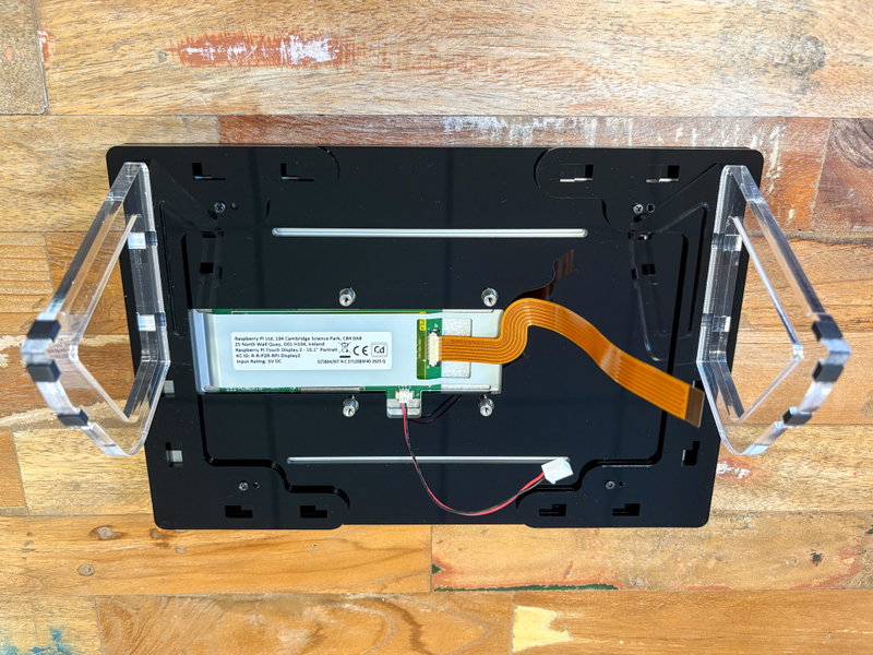 Both mounting plates secured to the back of the frame