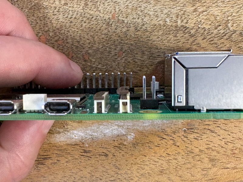 Pi 5 display connector 0 opened by lifting the tab upward