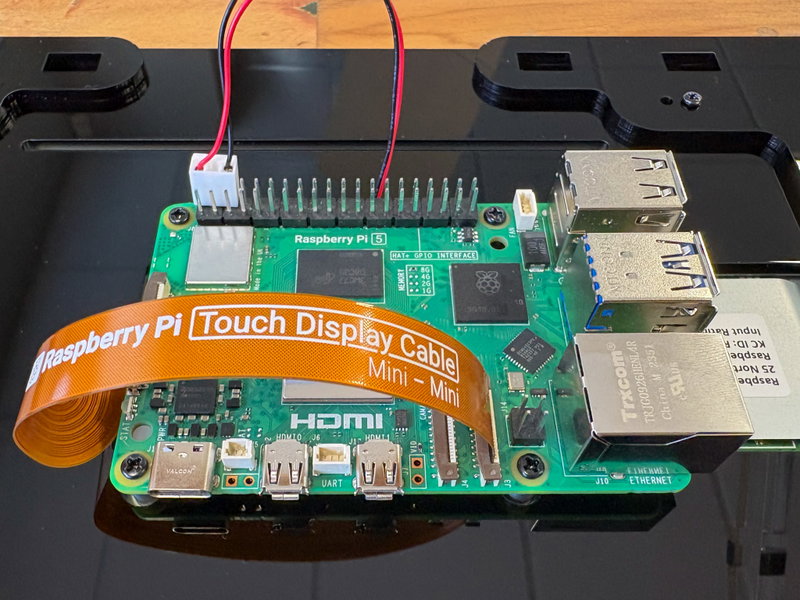Display power cable connected to the first three GPIO pins with red wire on pin 2