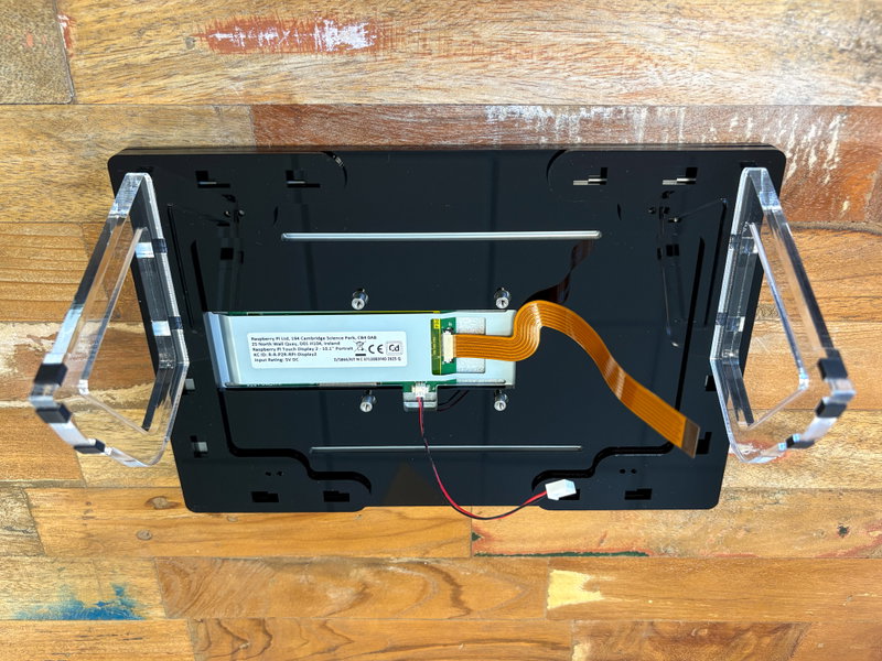 Mounting plates positioned on the back of the frame before screwing down