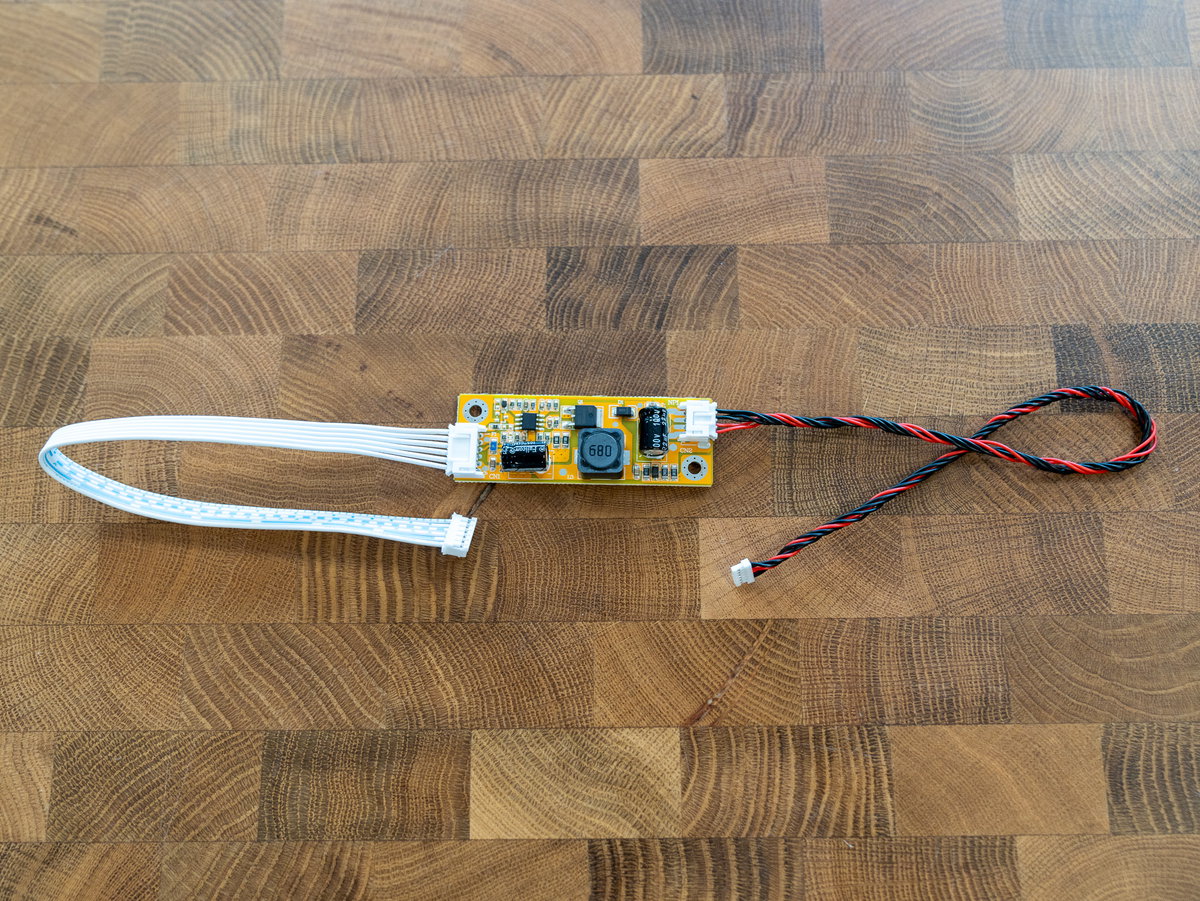 Smaller display driver board with its white and red-and-black cables connected