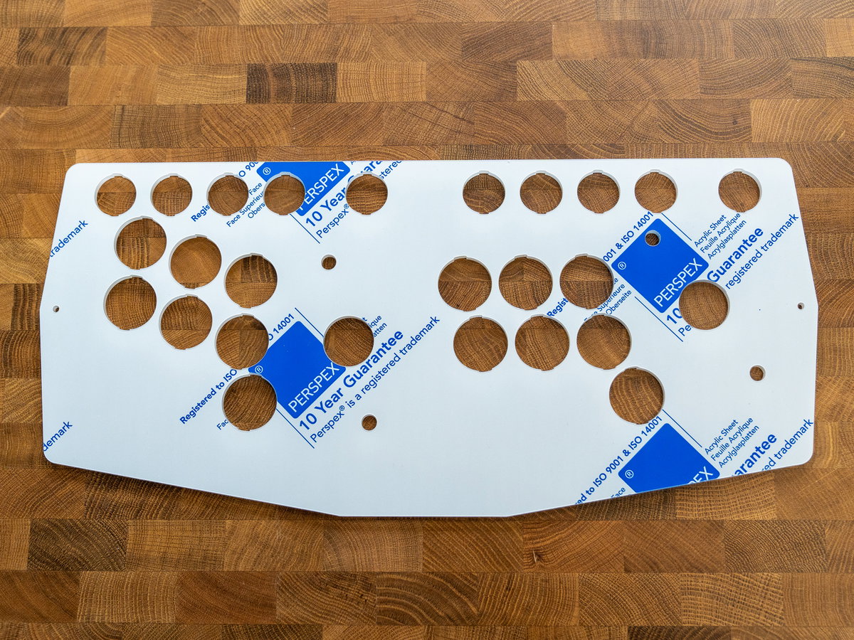 Underside of the two-player acrylic console panel