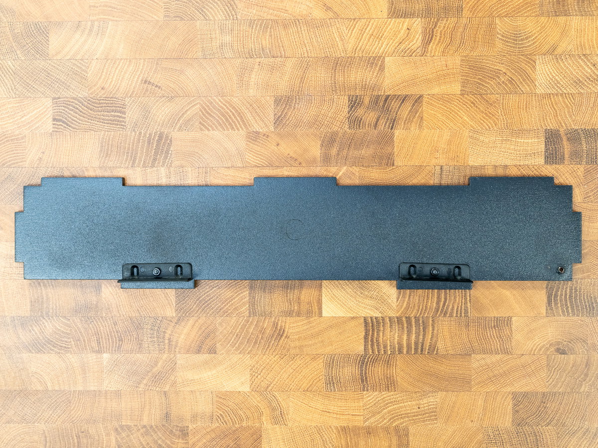 Two L-shaped brackets attached to panel C