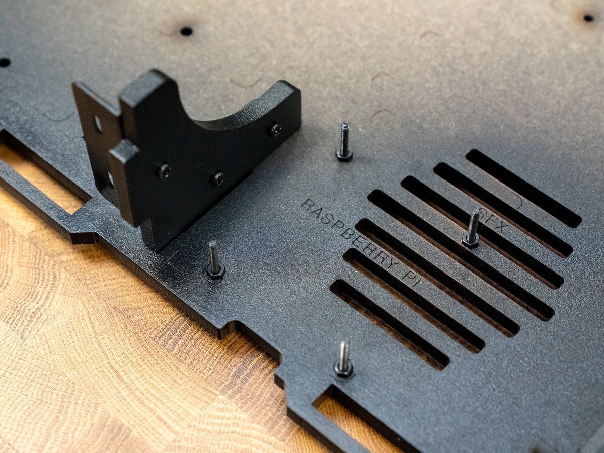M2.5 nuts fitted to screws through panel A for the NVMe Base