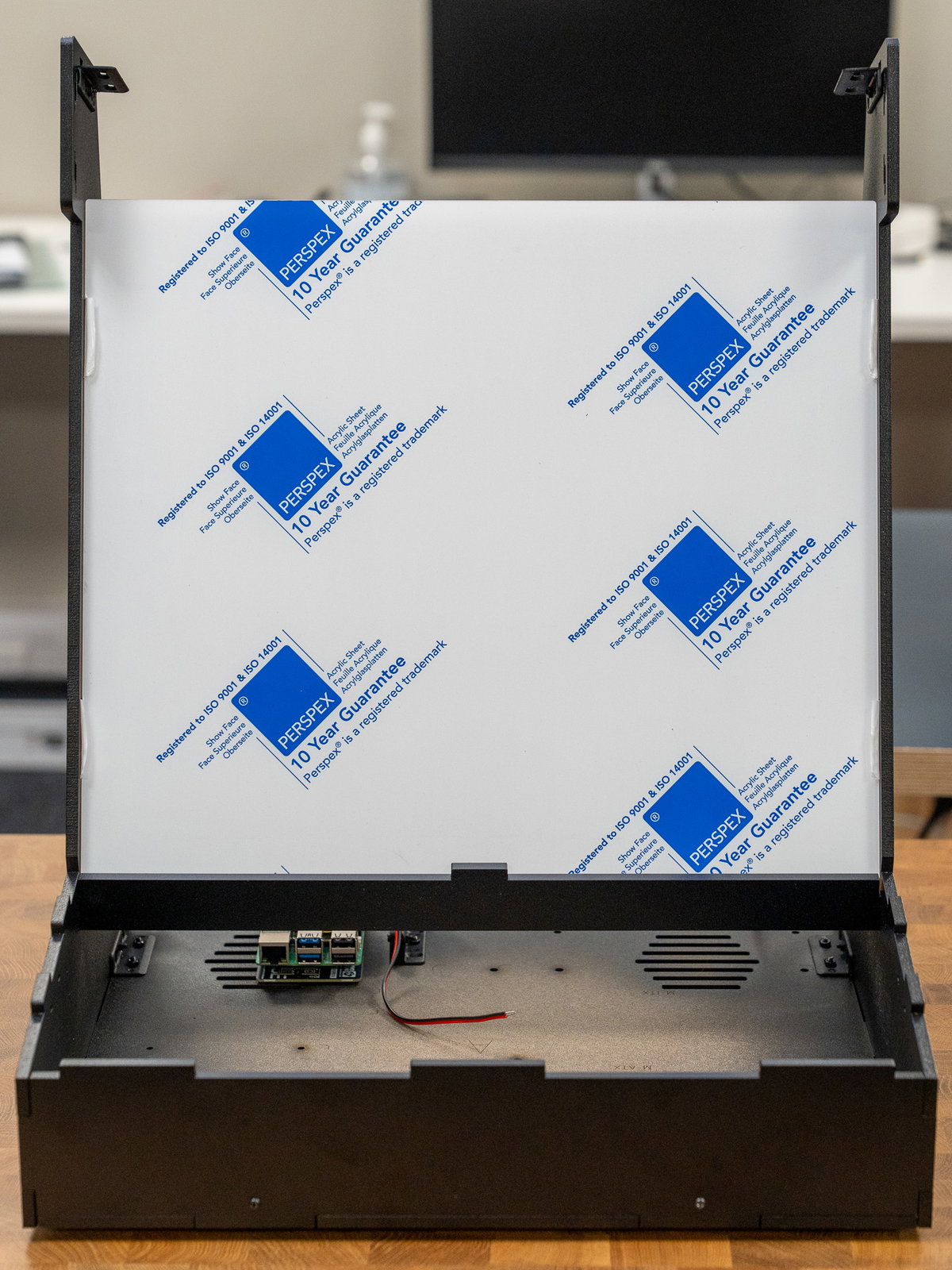 Acrylic screen panel secured between side panels D and E