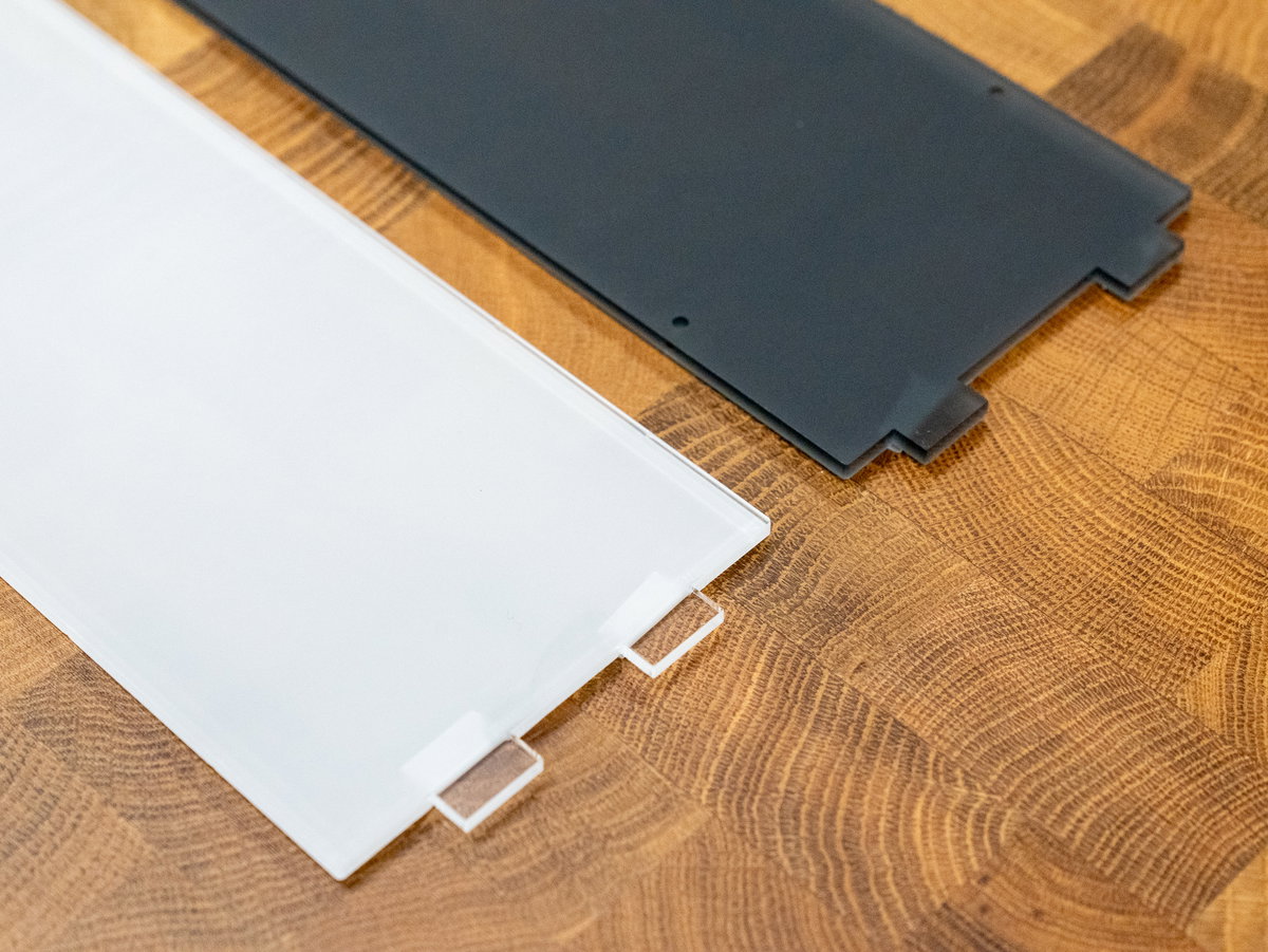 Protective backing removed from tabes on the reverse sides of the marquee panels