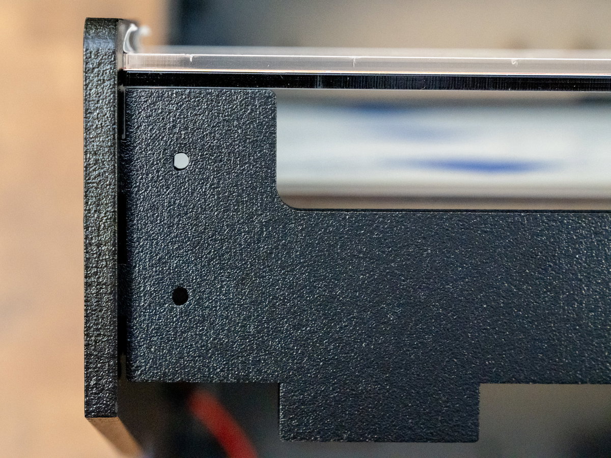 Tabs on wooden top panel G slotted into the Picade Max cabinet