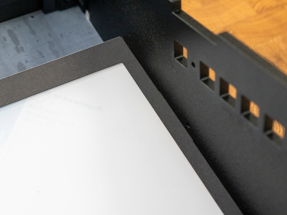 Screen surround tabs inserted into the Picade Max cabinet