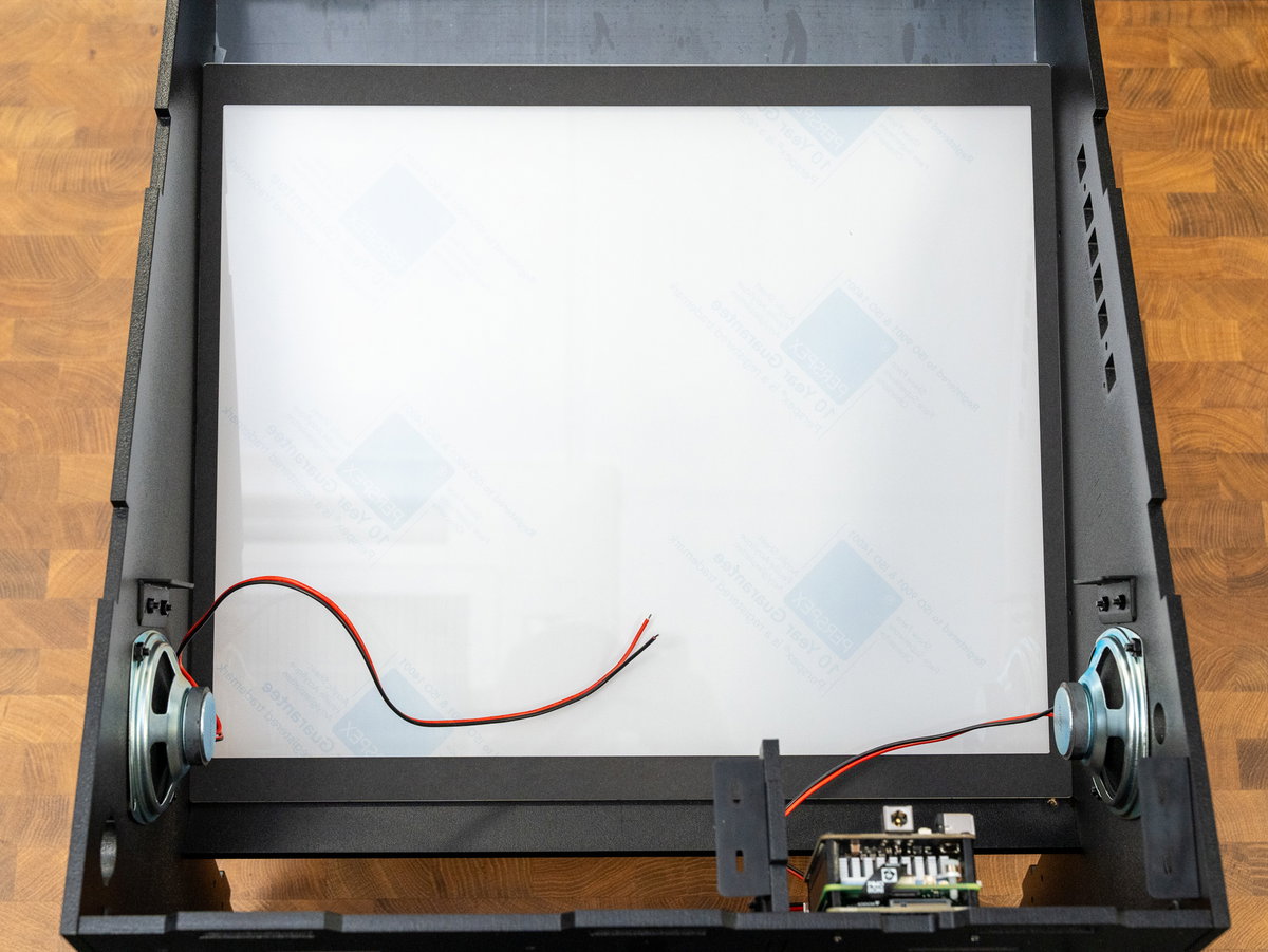Black screen surround fitted around the acrylic screen panel