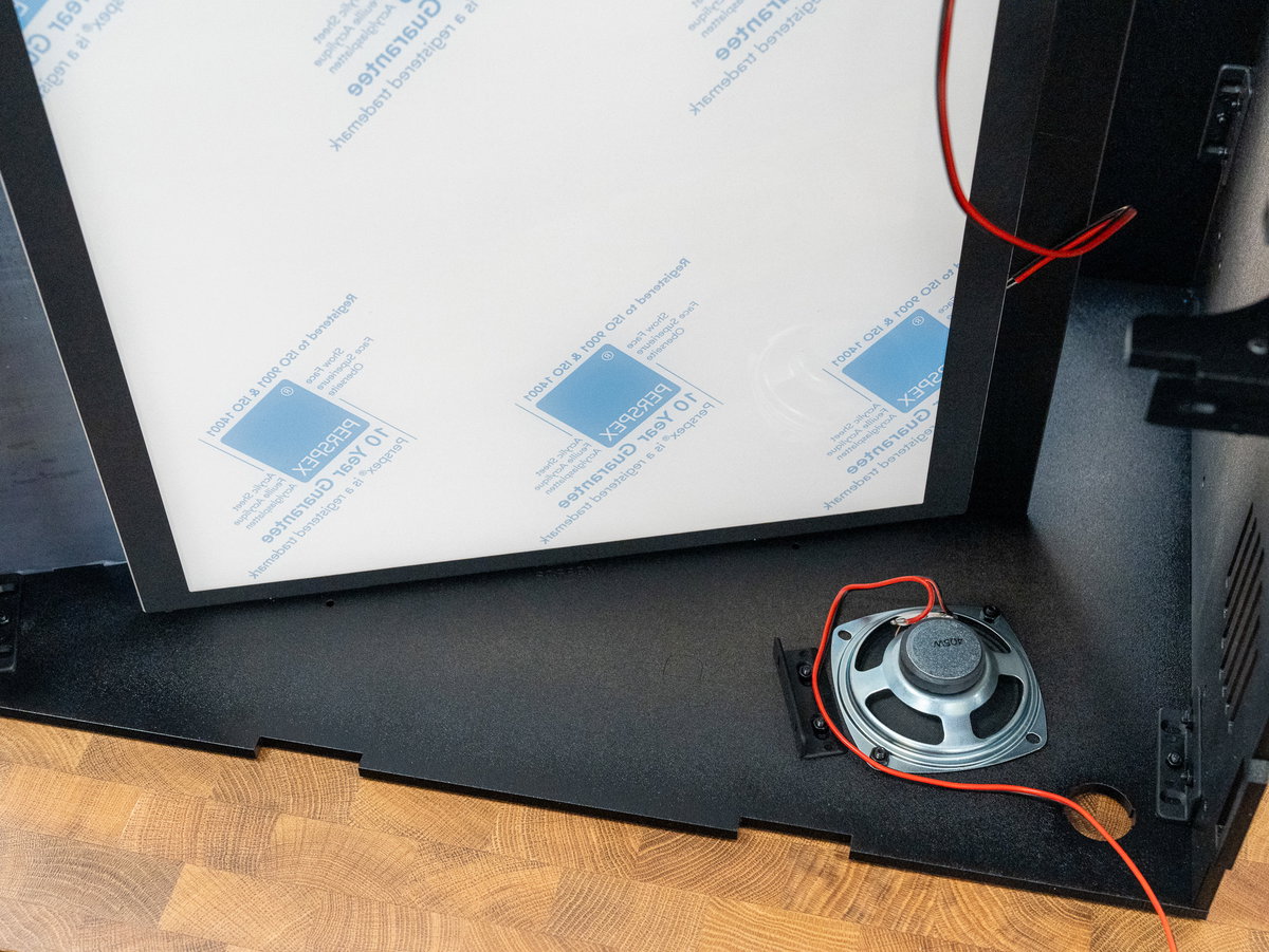 Picade Max cabinet resting on its side for display installation