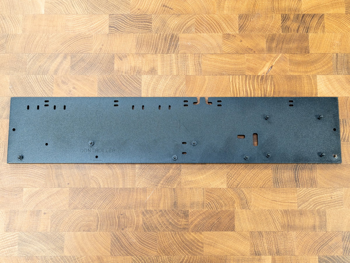 Panel K with flat-headed M2.5 screws fitted through the mounting holes