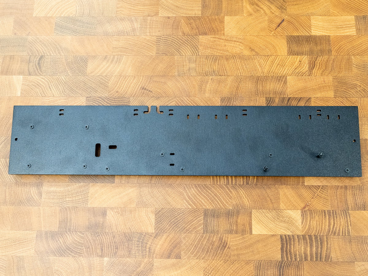 Long M2.5 screws fitted through the reverse side of panel K