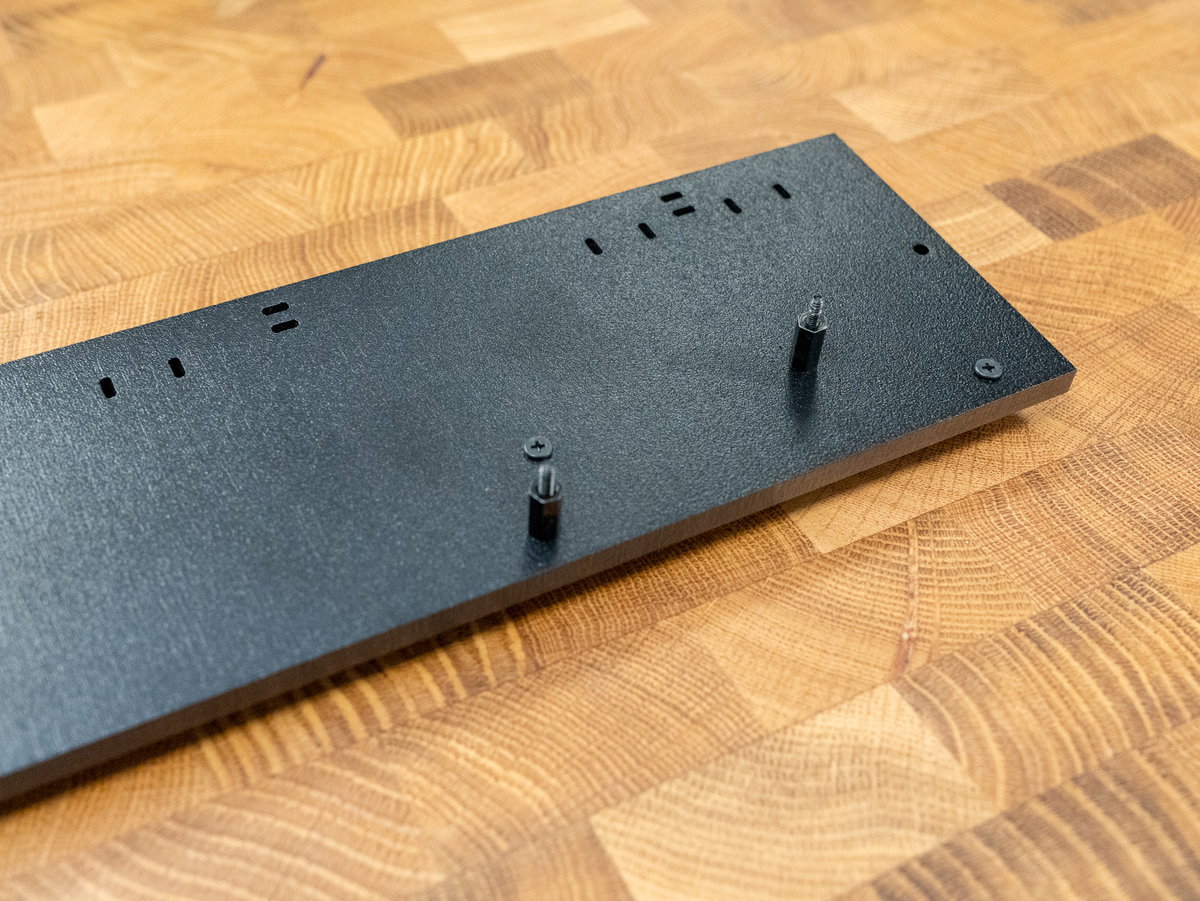 Medium M2.5 standoffs securing the long screws to panel K