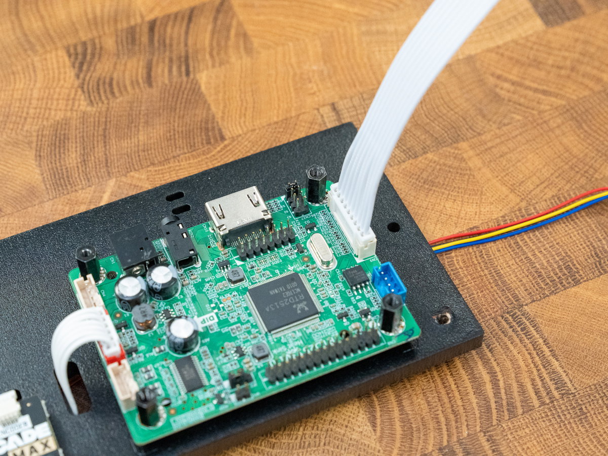 Nine-pin JST-PH cable connected to the larger display driver board