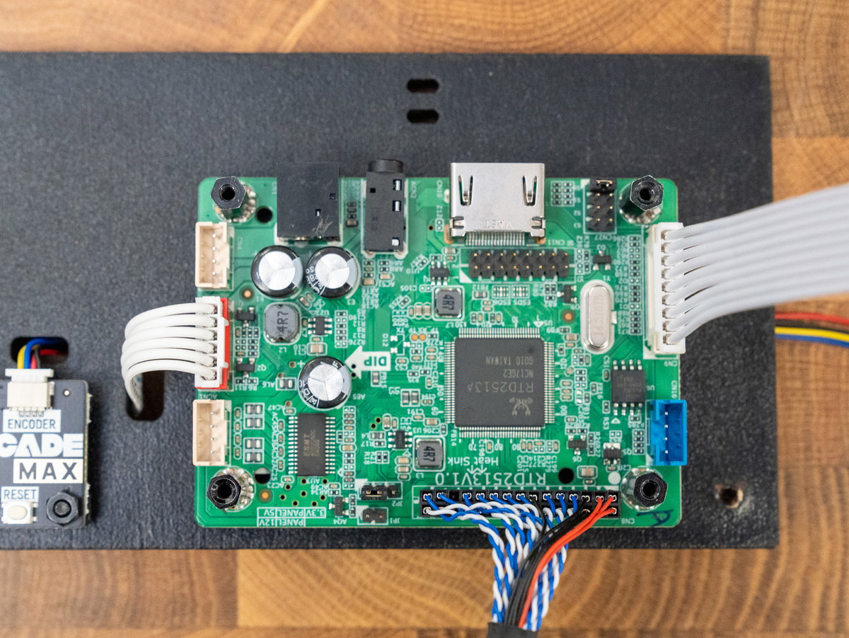 Red, black, and blue display cable connected to the larger driver board