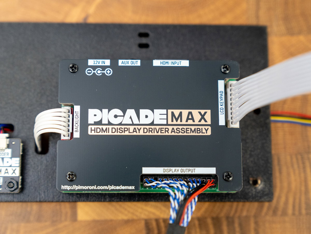 Display driver cover secured over the larger driver board