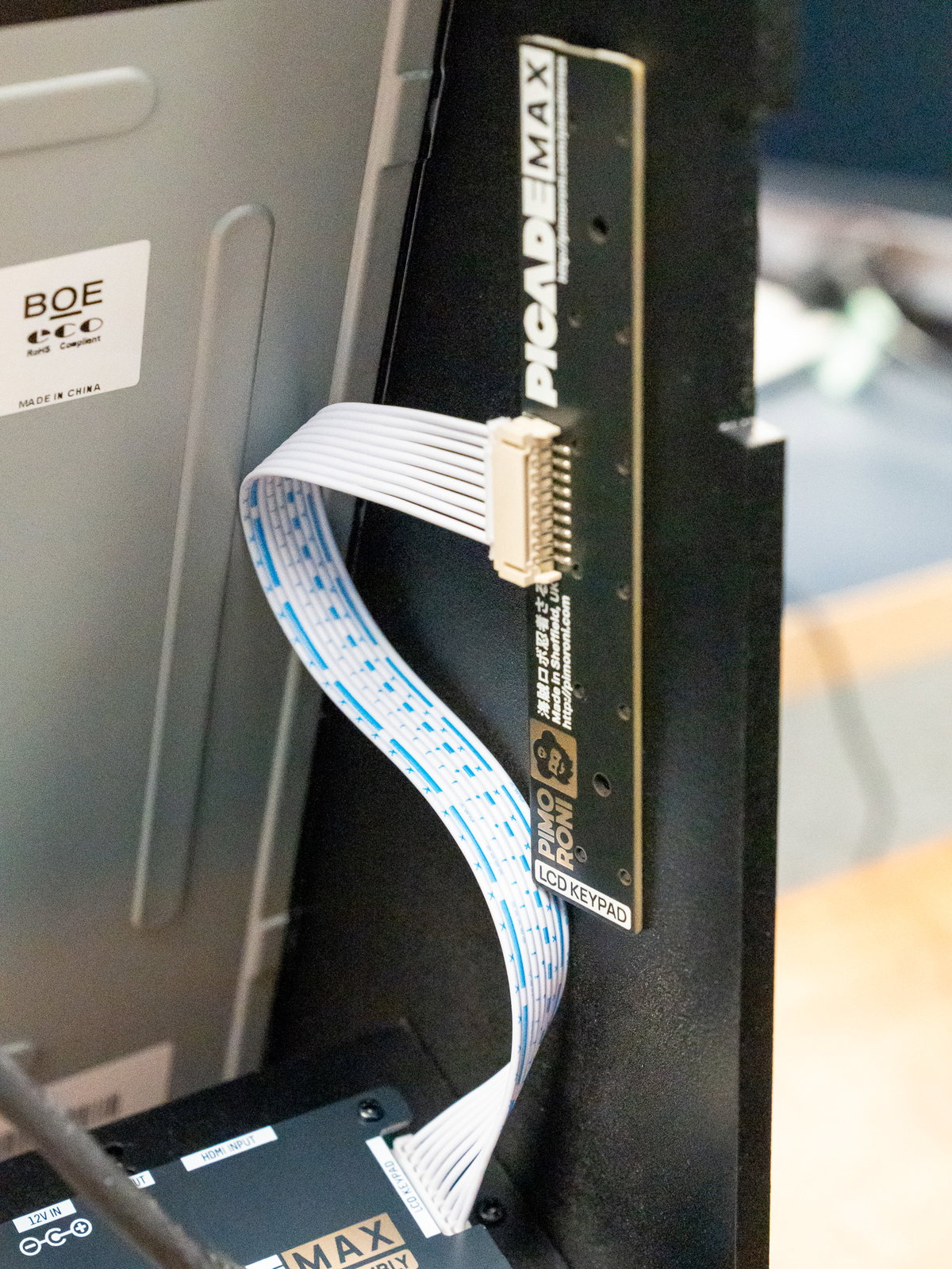 LCD Keypad buttons inserted through the cabinet side panel