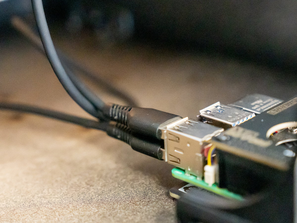 USB-A cable ends connected to the Raspberry Pi
