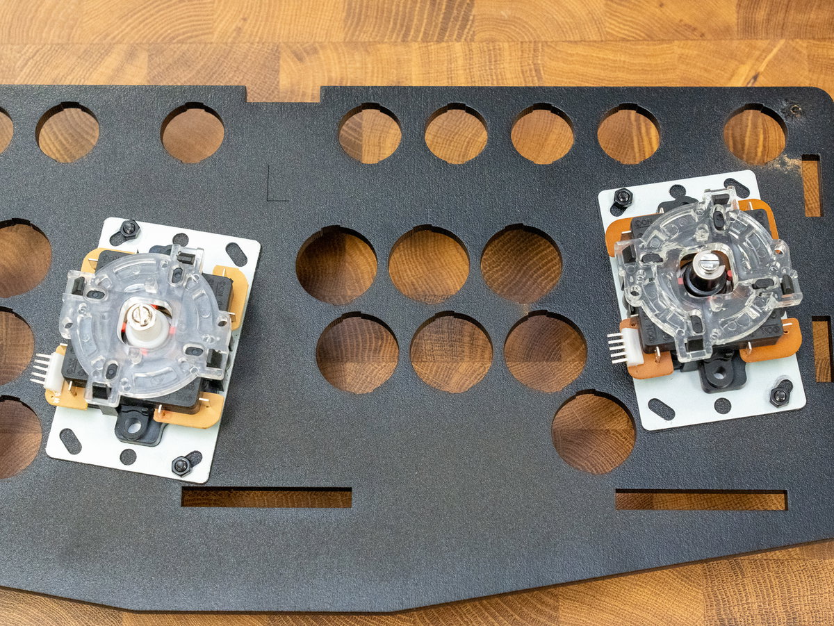 Two joysticks secured to the two-player console panel with M4 fixings