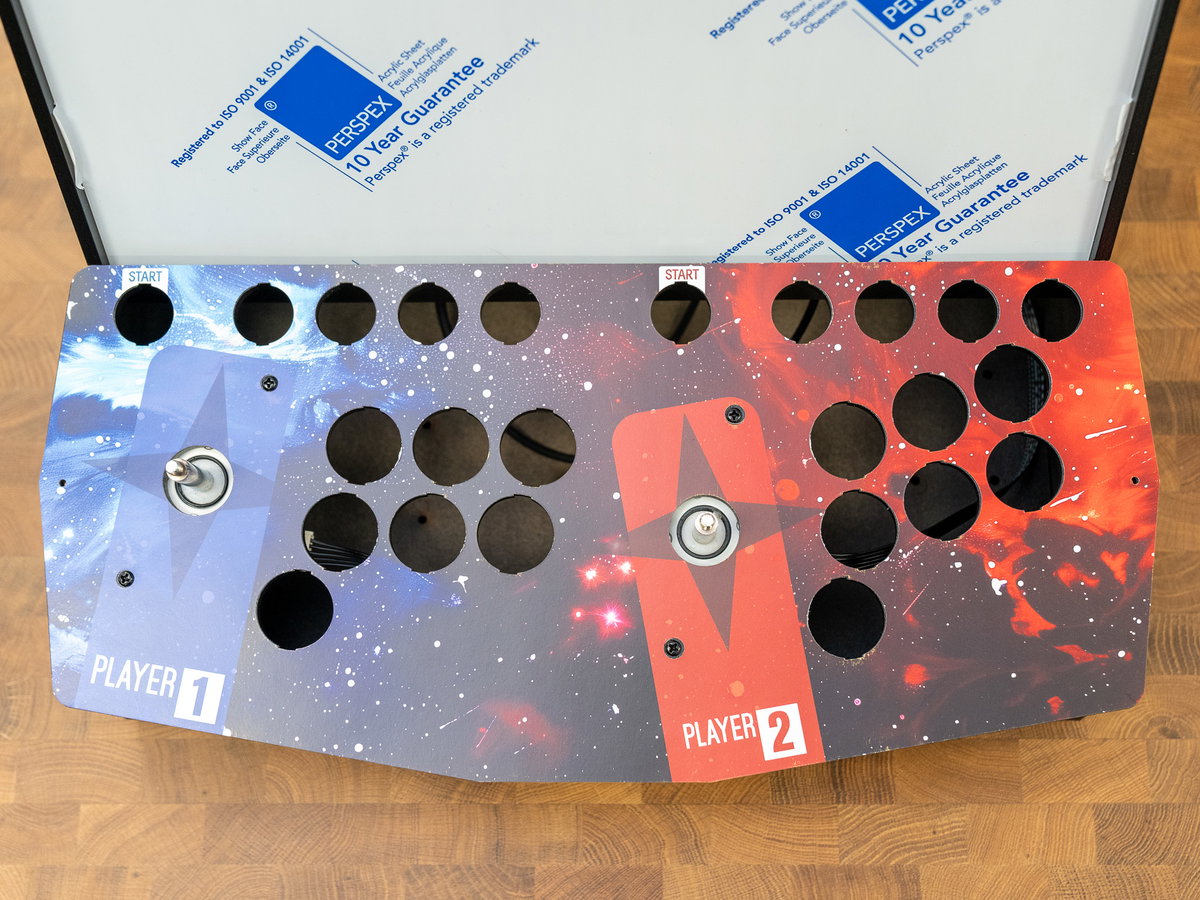 Two-player cardboard console artwork aligned over the console panel