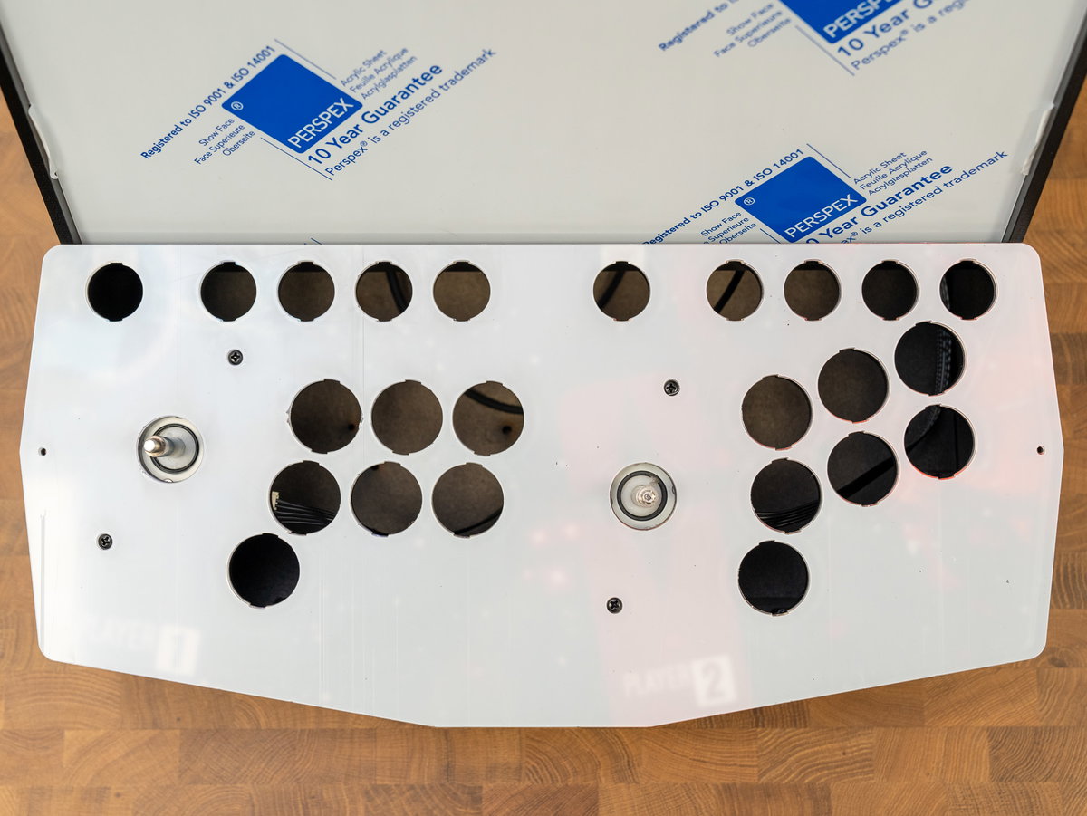 Acrylic console panel placed over the two-player artwork