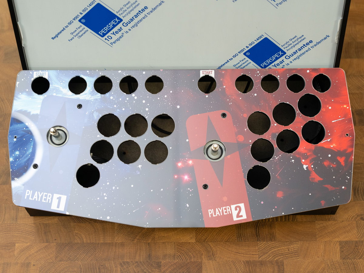 Protective coating removed from the top of the two-player acrylic panel