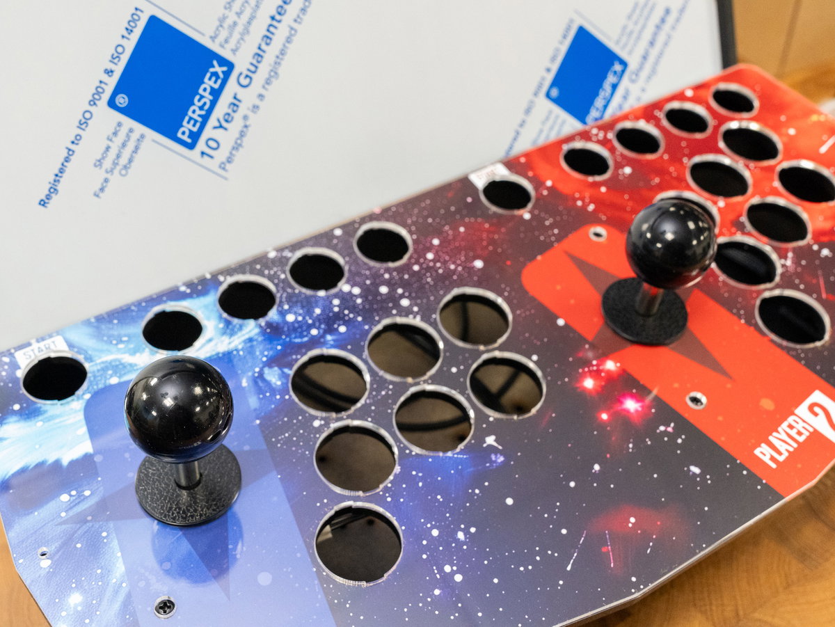 Joystick collars and balls fitted to the two-player console