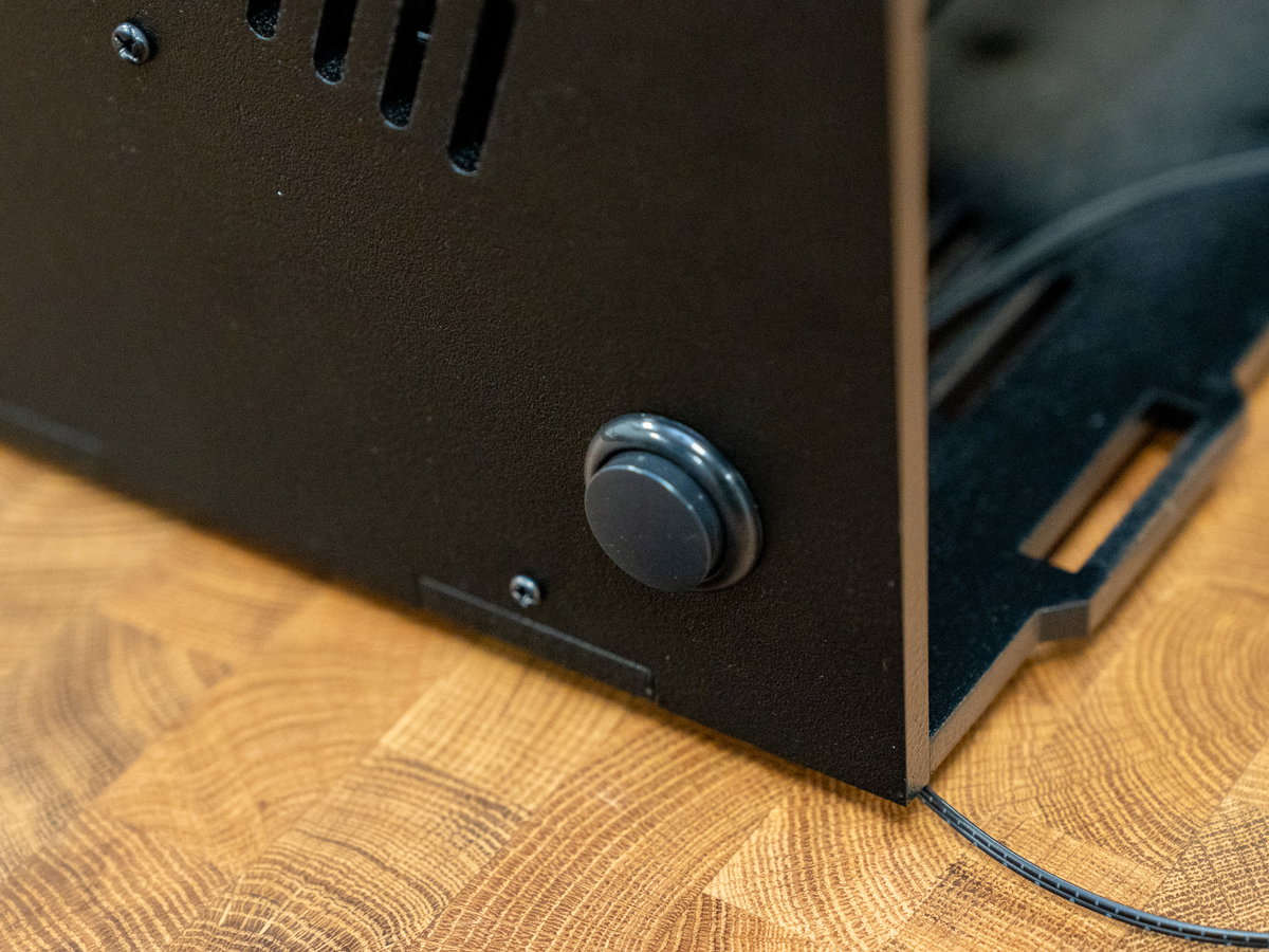 One-player side button and wires inserted through panel D
