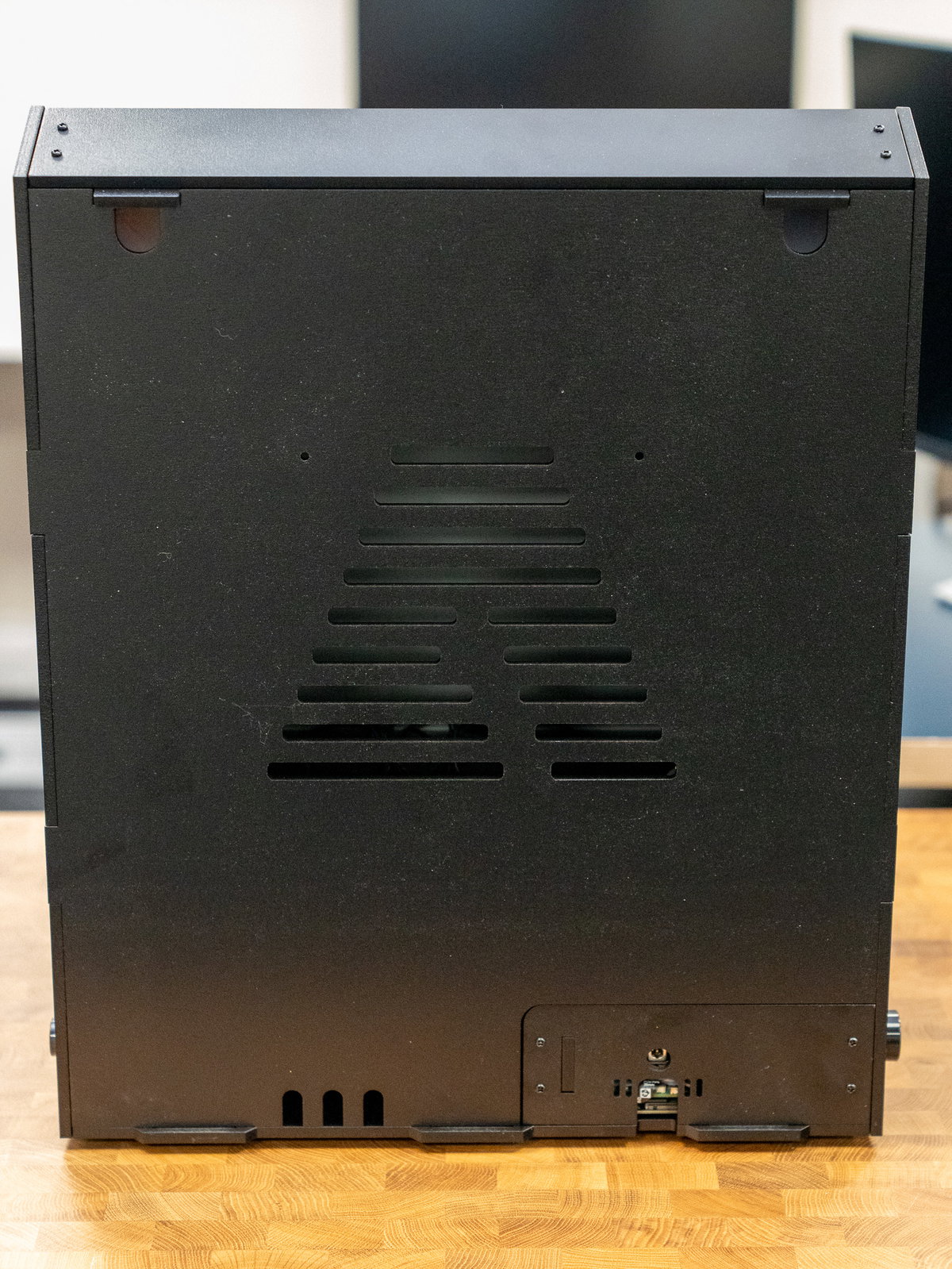 Back panel tabs aligned with the cabinet base and rear slots