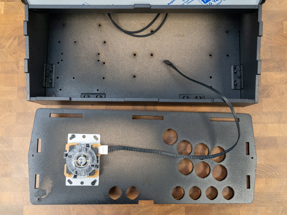One-player console panel positioned in front of the cabinet with joystick cable routed inside