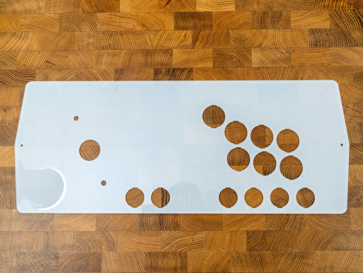 Underside of the one-player acrylic console panel with the protective coating removed