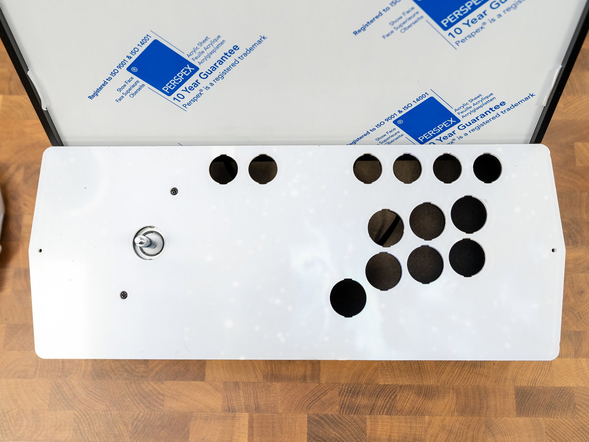 Acrylic console panel placed over the one-player artwork
