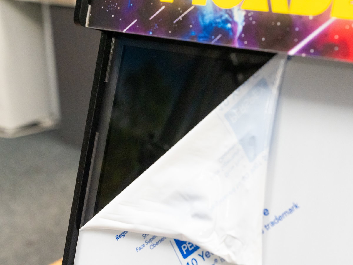 Protective coating being removed from the acrylic screen