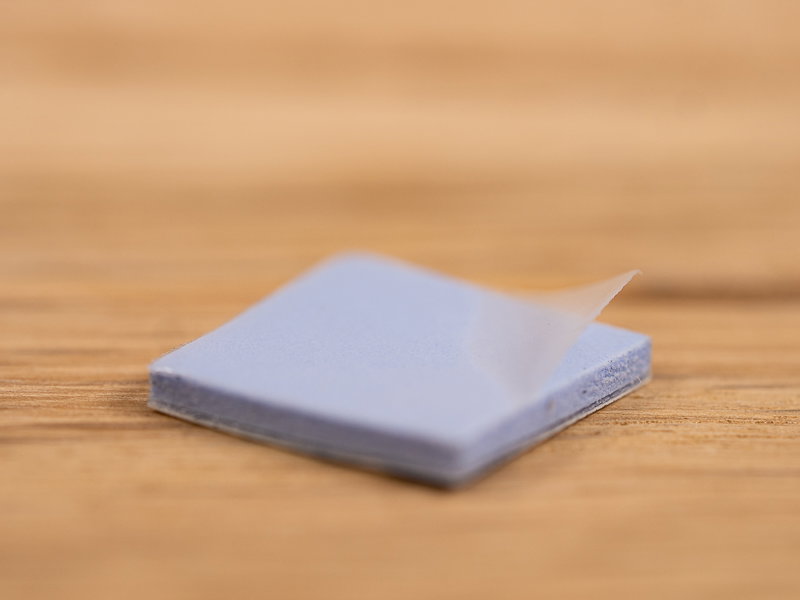 Thin, clear film on thermal pad