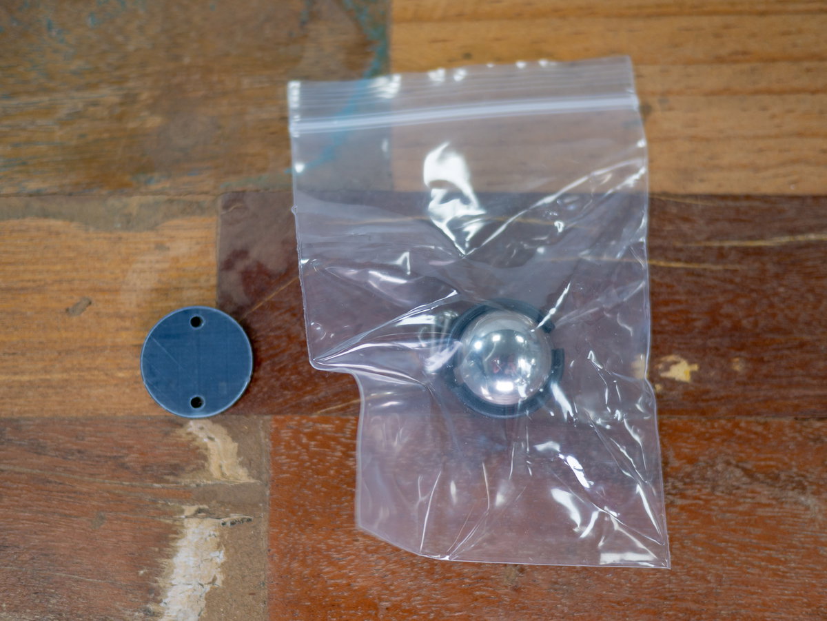 Castor, fixings and acrylic spacer