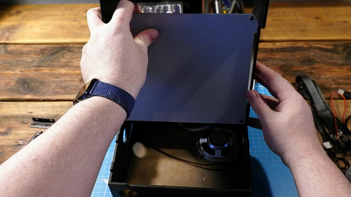 Fitting the screen assembly into the cabinet