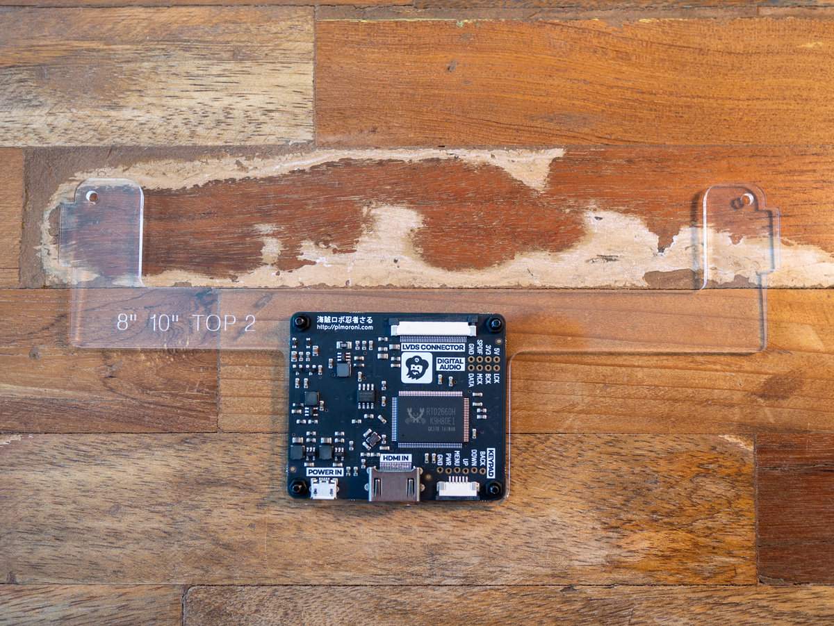 Display driver board positioned on its acrylic bracket