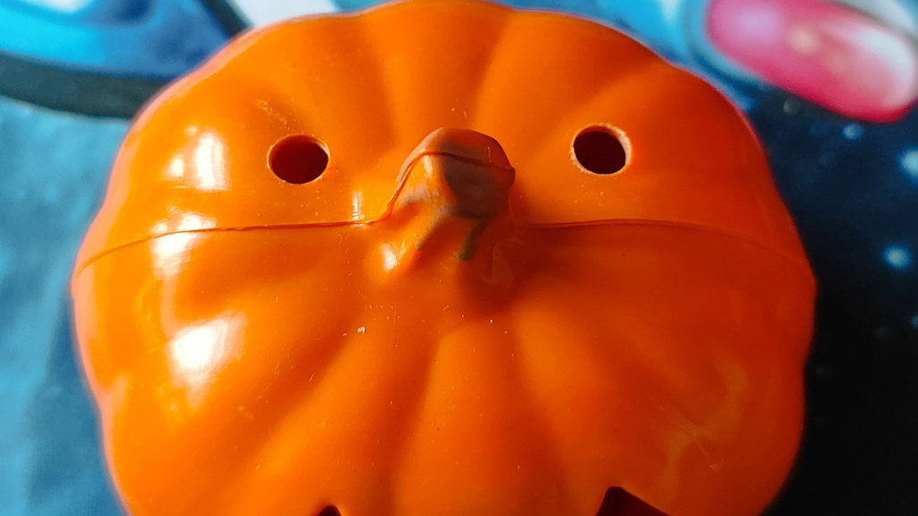 Holes made in the plastic pumpkin for the screws