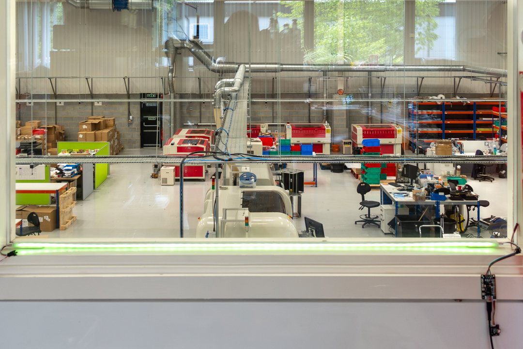 A strip of neon effect LEDs overlooking the Pimoroni warehouse