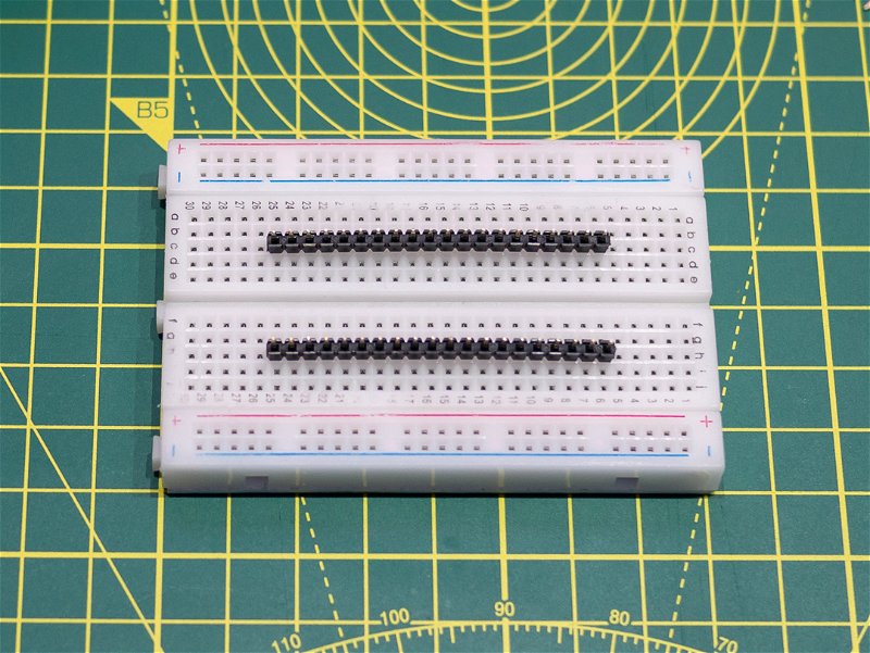 Long ends of headers poked into breadboard