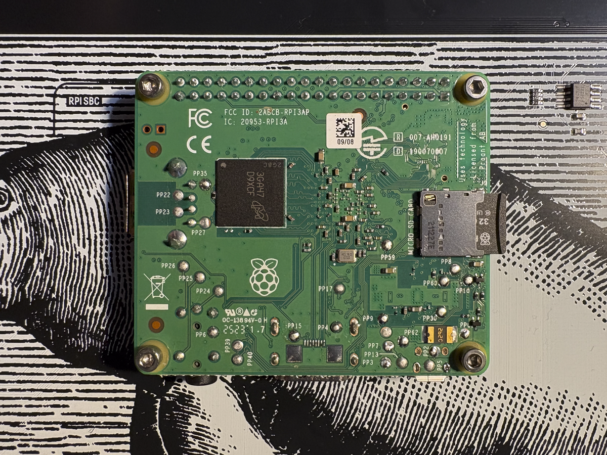 Pi plugged into Inky Impression and secured with hex screws